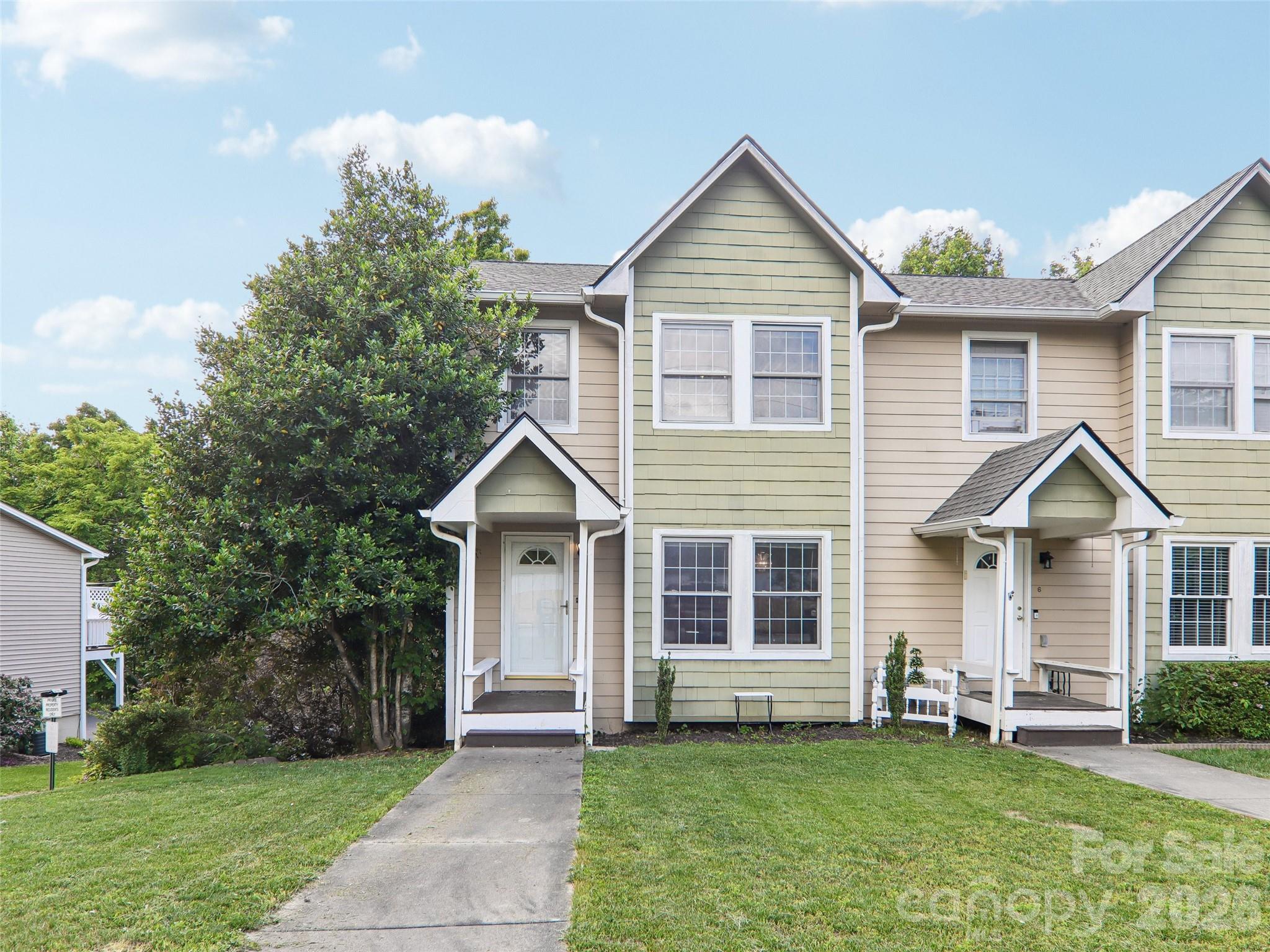 34 Union Chapel Road, Unit 7 Weaverville, NC 28787 - Photo 1 of 37 a front view of a house with a garden