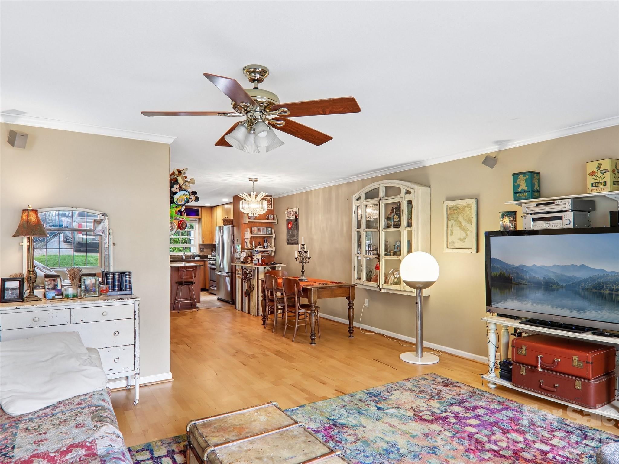 34 Union Chapel Road, Unit 7 Weaverville, NC 28787 - Photo 6 of 37 a living room with furniture and a flat screen tv