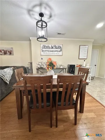 a view of a dining room with furniture