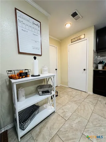 a kitchen with a cabinets and a stove top oven