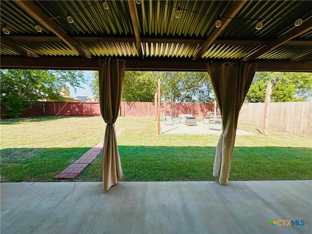 a view of a backyard with a garden