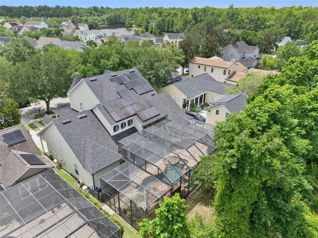 908 Croton Road Celebration, FL 34747 - Photo 63 of 86 an aerial view of multiple houses with a yard