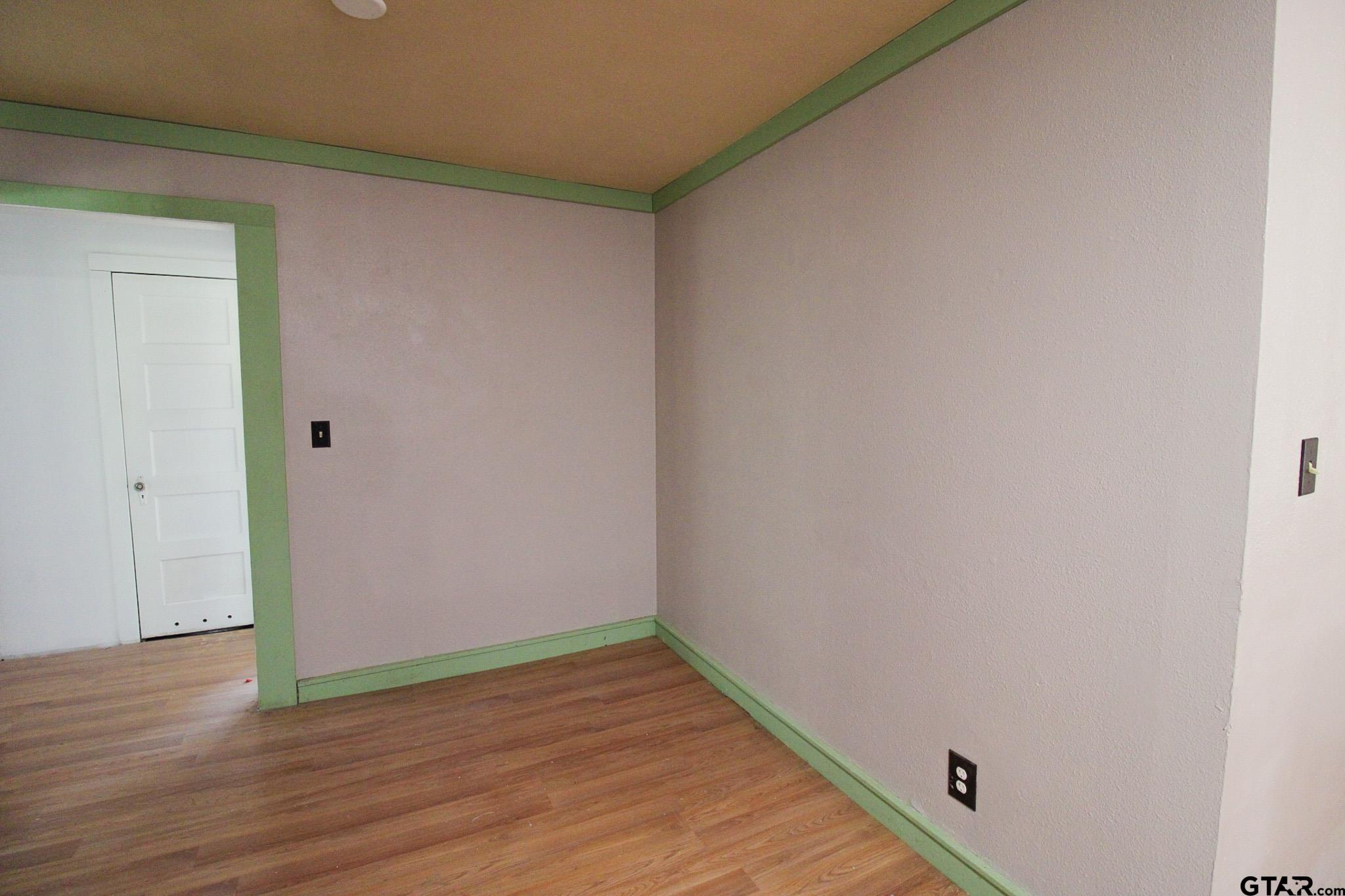 407 Pace Street Naples, TX 75568 - Photo 11 of 31 a view of a small space with wooden floor
