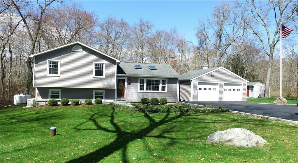 259 Greenhaven Road Stonington, CT 06379 - Photo 1 of 1 a front view of a house with garden