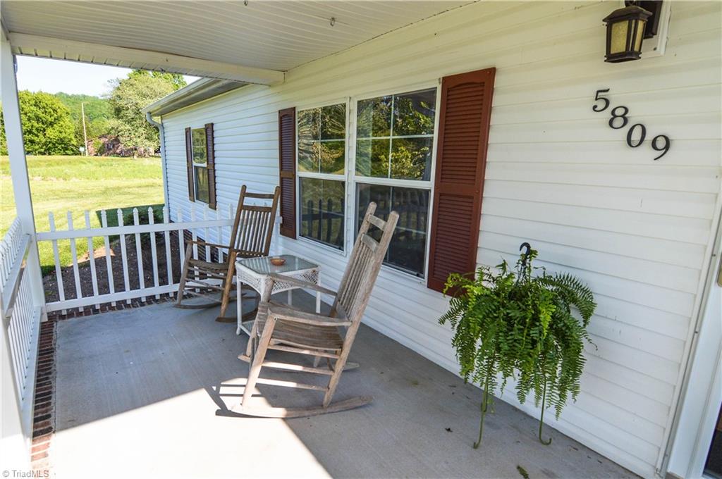 5809 Clingman Road Hamptonville, NC 27020 - Photo 2 of 22 Come sit a spell and enjoy the view from your front porch!