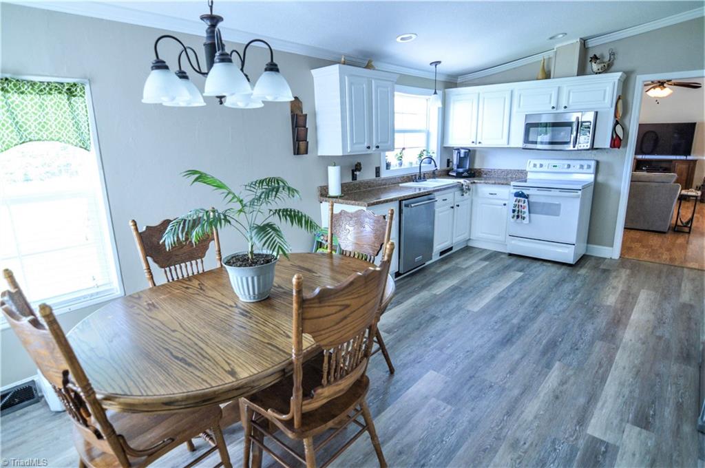 5809 Clingman Road Hamptonville, NC 27020 - Photo 11 of 22 The Kitchen has plenty of open space, beautiful cabinets and flooring!