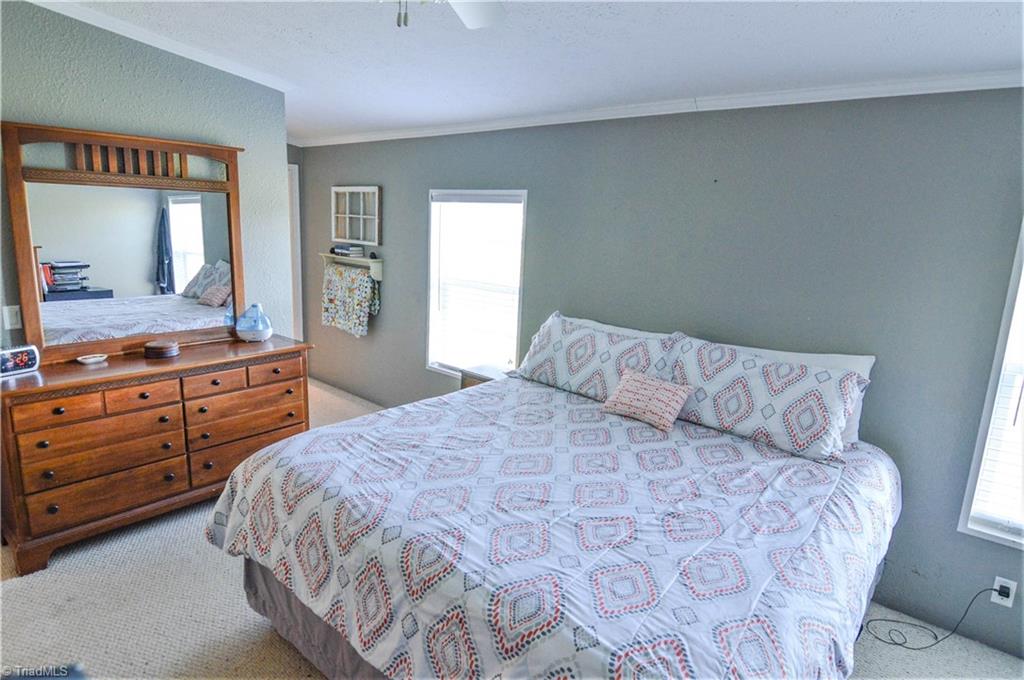 5809 Clingman Road Hamptonville, NC 27020 - Photo 15 of 22 The primary bedroom is spacious.