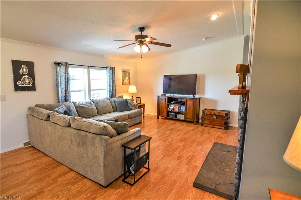 5809 Clingman Road Hamptonville, NC 27020 - Photo 9 of 22 Living Room view from Kitchen; beautiful flooring; great lighting.