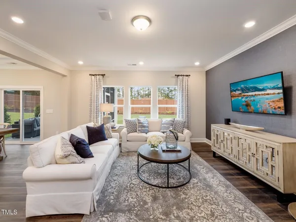 a living room with furniture and a table