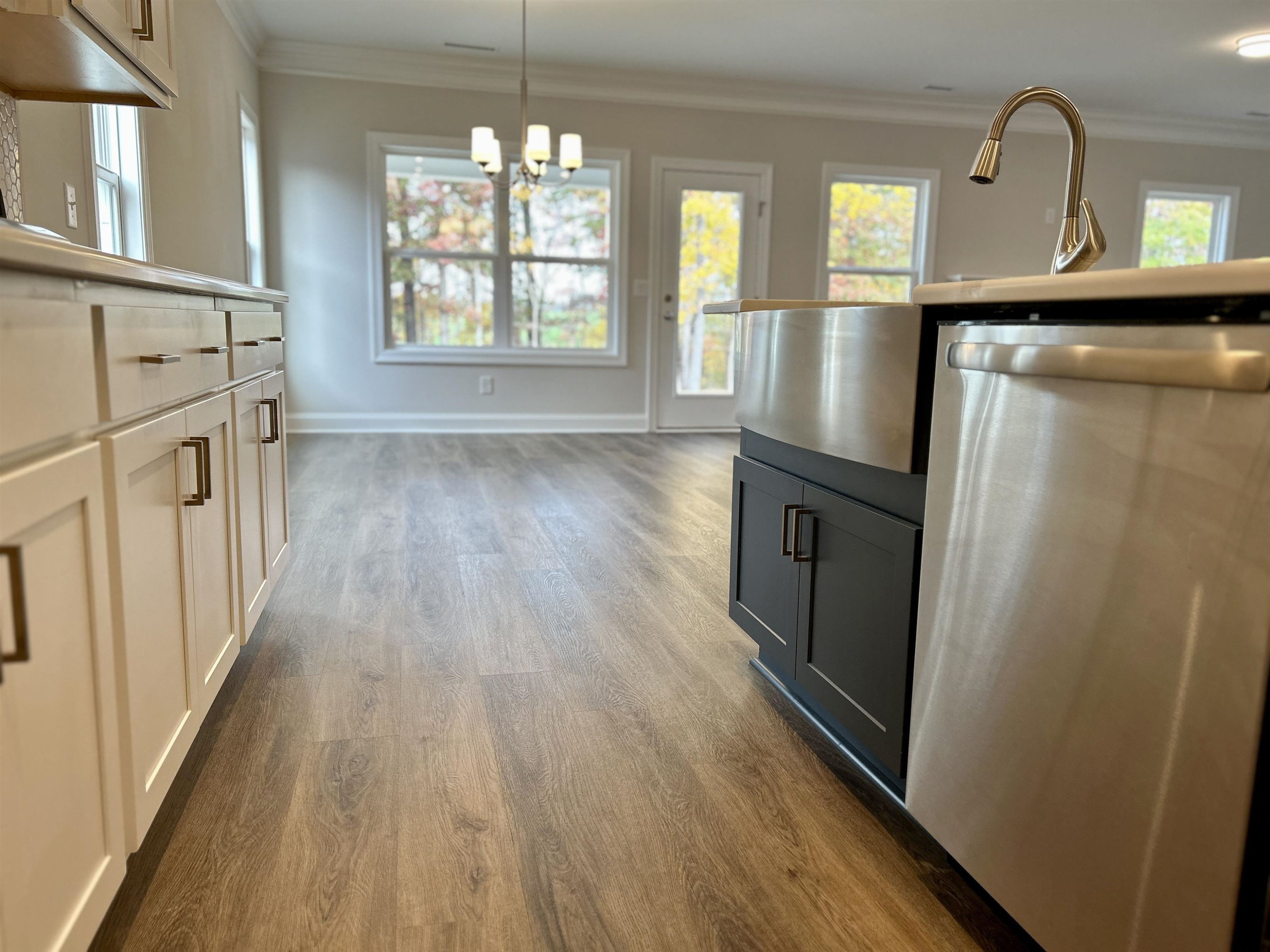 208 Kavanaugh Road Wake Forest, NC 27587 - Photo 4 of 23 a view of a kitchen with furniture and wooden floor