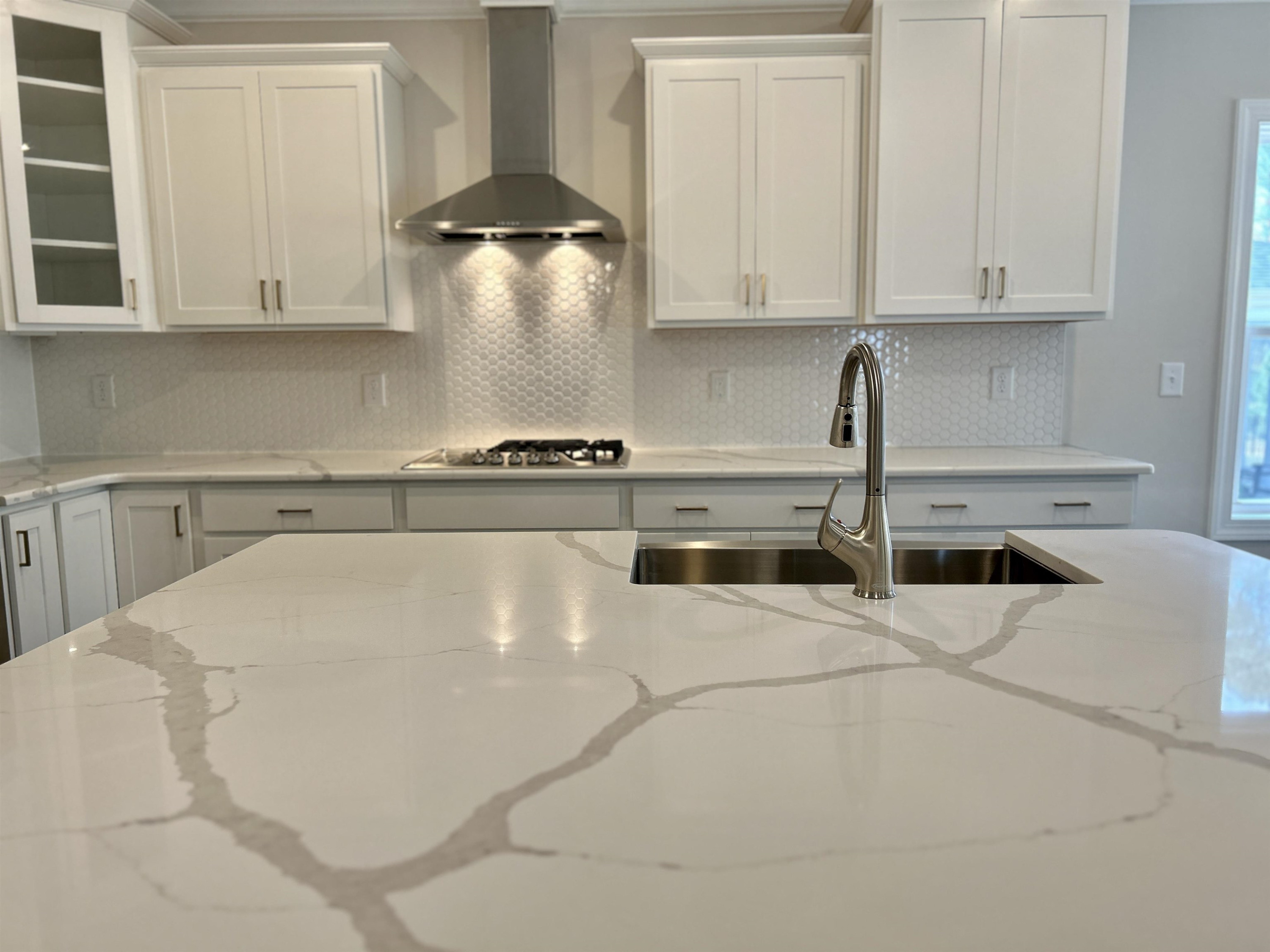 208 Kavanaugh Road Wake Forest, NC 27587 - Photo 5 of 23 a kitchen with stainless steel appliances granite countertop a sink a stove and white cabinets