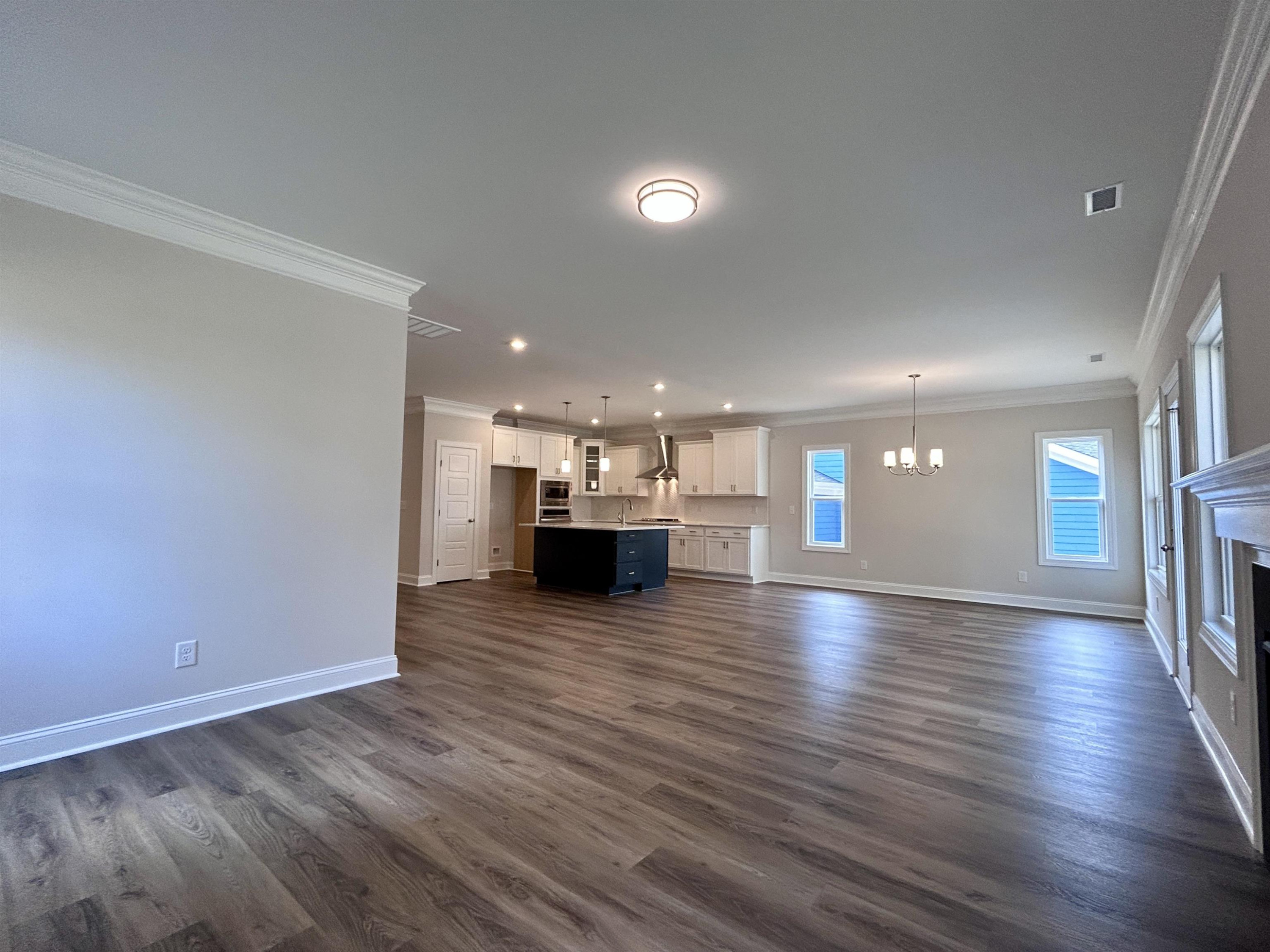 208 Kavanaugh Road Wake Forest, NC 27587 - Photo 7 of 23 a view of empty room with wooden floor