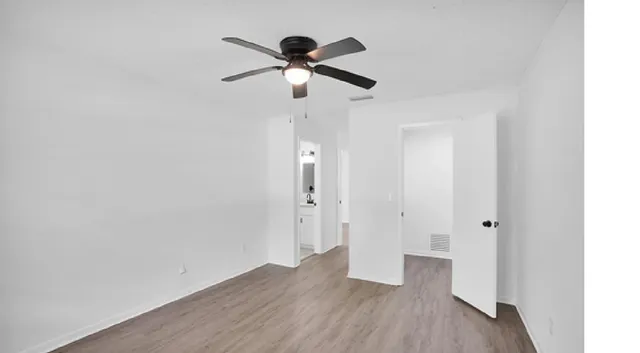 a view of a kitchen from the hallway
