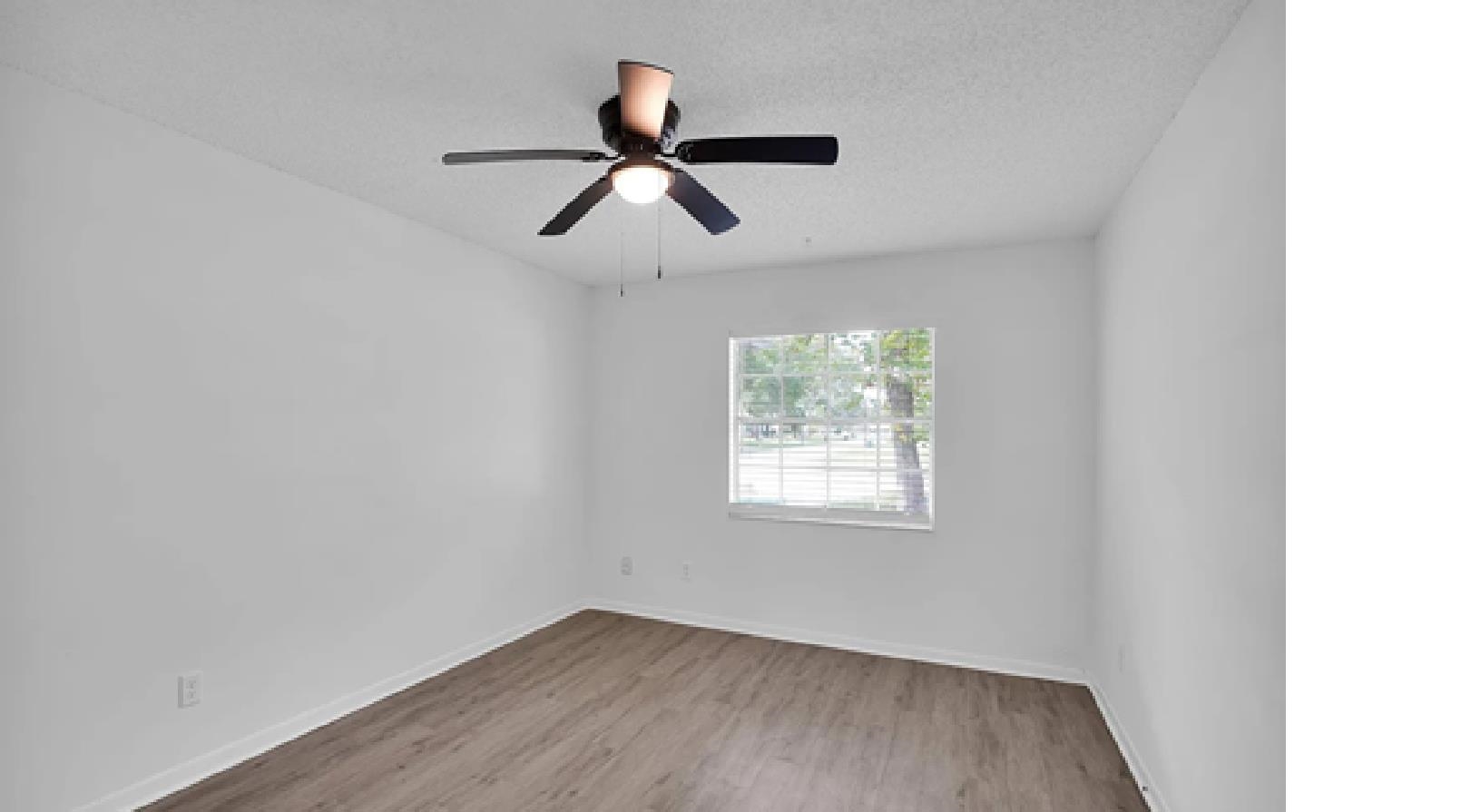 1010 San Remo Road St. Augustine, FL 32086 - Photo 14 of 47 a view of a room with wooden floor and windows