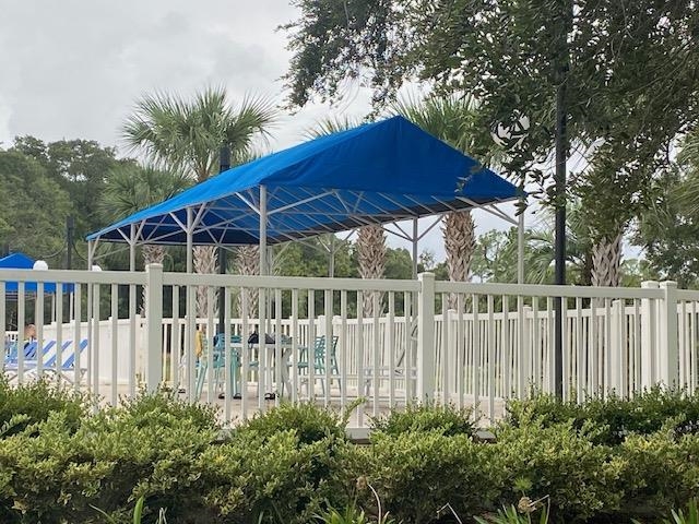 1010 San Remo Road St. Augustine, FL 32086 - Photo 27 of 47 a view of a deck with a small yard and wooden fence