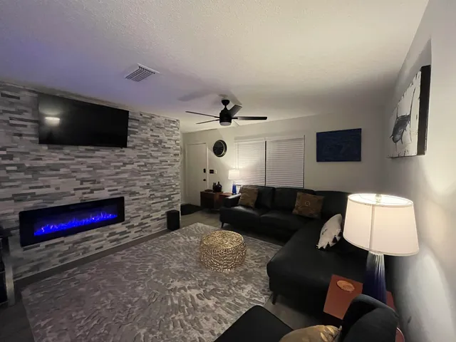 a view of a table and chairs under an umbrella