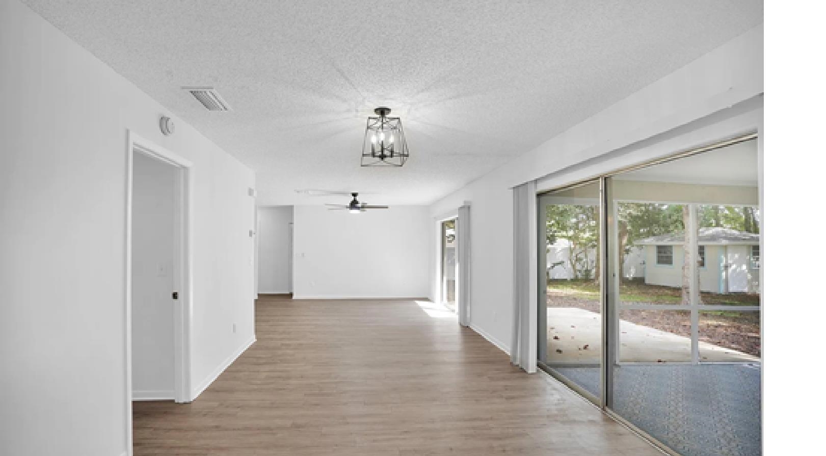 1010 San Remo Road St. Augustine, FL 32086 - Photo 8 of 47 a view of a hallway with a chandelier
