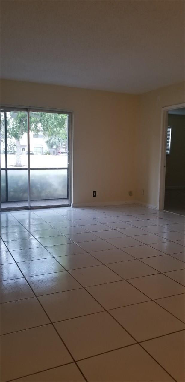 255 South Cypress Road, Unit 301 Pompano Beach, FL 33060 - Photo 12 of 42 a view of empty room with wooden floor and fan