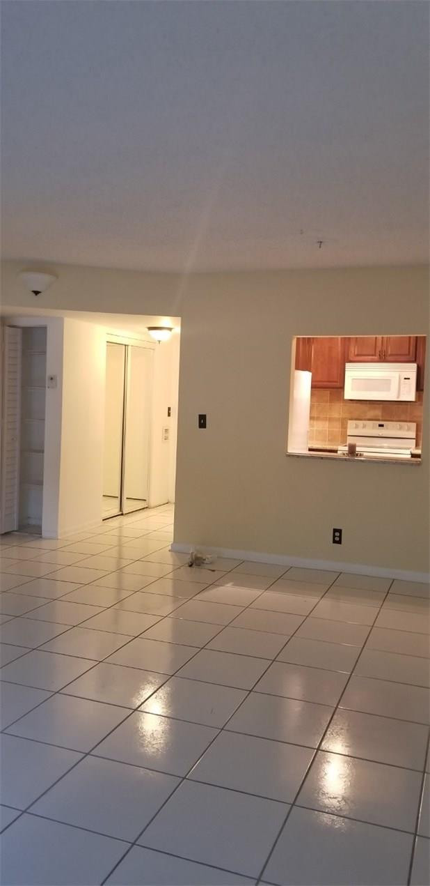 255 South Cypress Road, Unit 301 Pompano Beach, FL 33060 - Photo 14 of 42 a view of an empty room and window