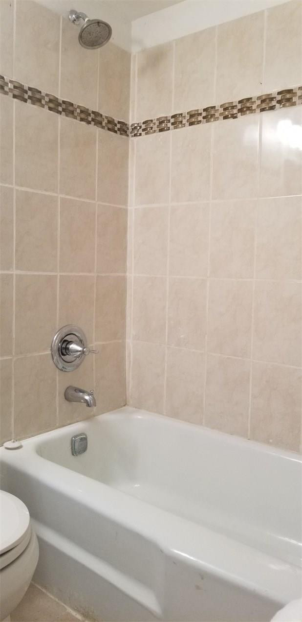 255 South Cypress Road, Unit 301 Pompano Beach, FL 33060 - Photo 22 of 42 a bathroom with a shower and a bathtub