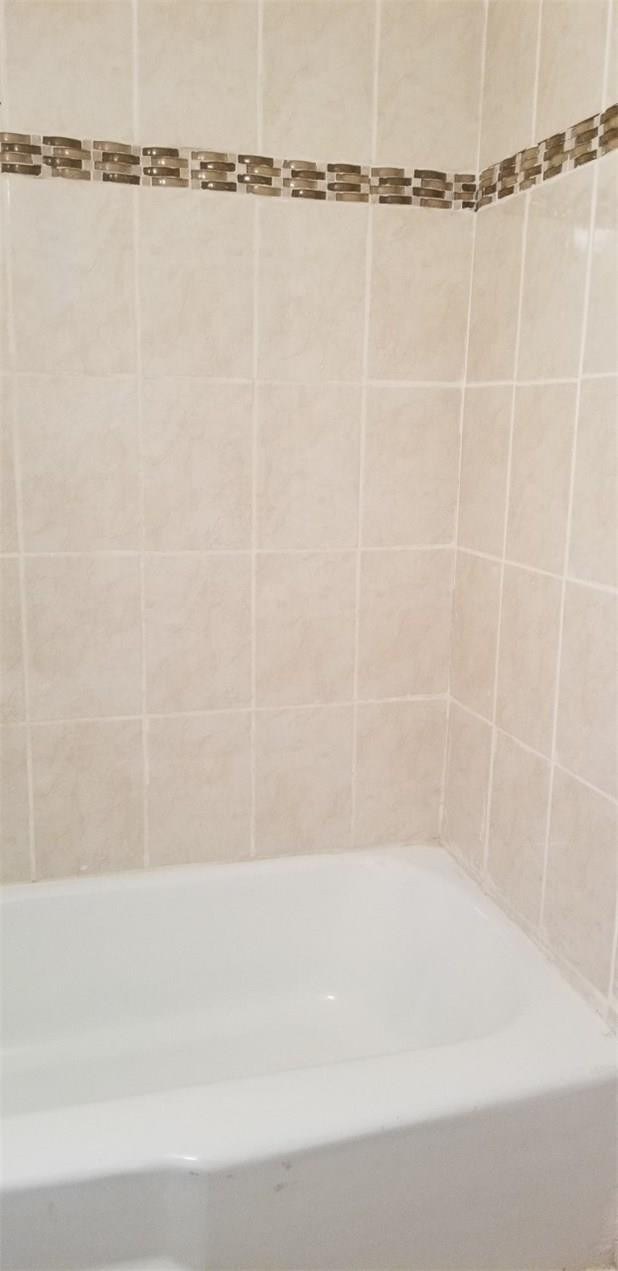 255 South Cypress Road, Unit 301 Pompano Beach, FL 33060 - Photo 23 of 42 a bathroom with a bathtub and a shower