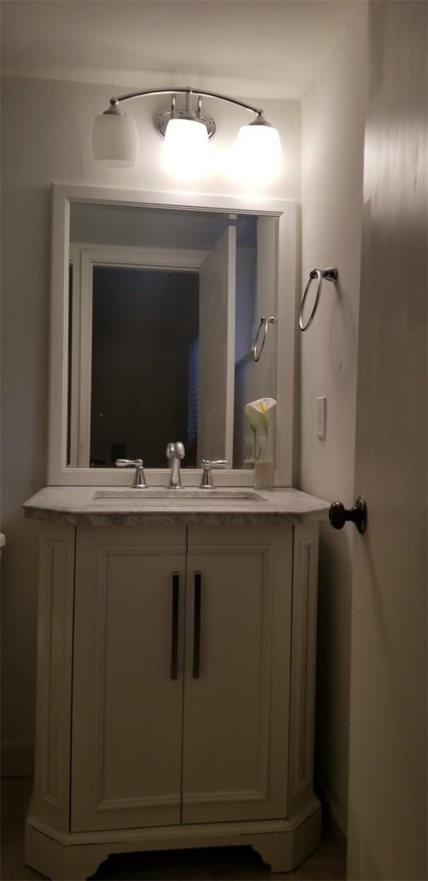 255 South Cypress Road, Unit 301 Pompano Beach, FL 33060 - Photo 27 of 42 a bathroom with a sink and a mirror