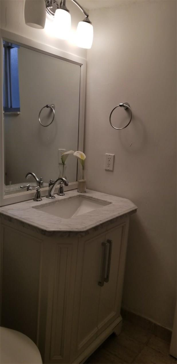 255 South Cypress Road, Unit 301 Pompano Beach, FL 33060 - Photo 29 of 42 a sink with a mirror