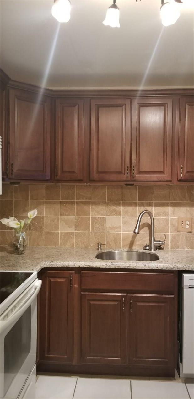 255 South Cypress Road, Unit 301 Pompano Beach, FL 33060 - Photo 3 of 42 a kitchen with stainless steel appliances granite countertop a sink a stove and cabinets
