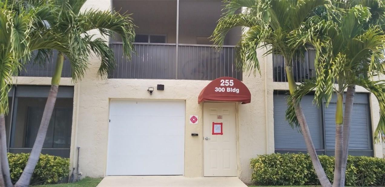 255 South Cypress Road, Unit 301 Pompano Beach, FL 33060 - Photo 38 of 42 a front view of a house with a tree