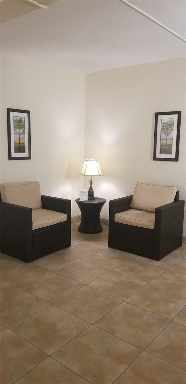 255 South Cypress Road, Unit 301 Pompano Beach, FL 33060 - Photo 39 of 42 a living room with couches and night stand