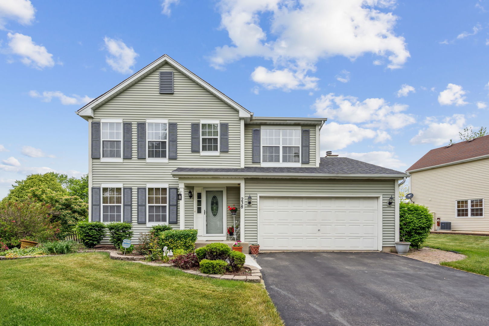 238 Ironbark Way Bolingbrook, IL 60440 - Photo 1 of 21 a front view of a house with a yard and garage