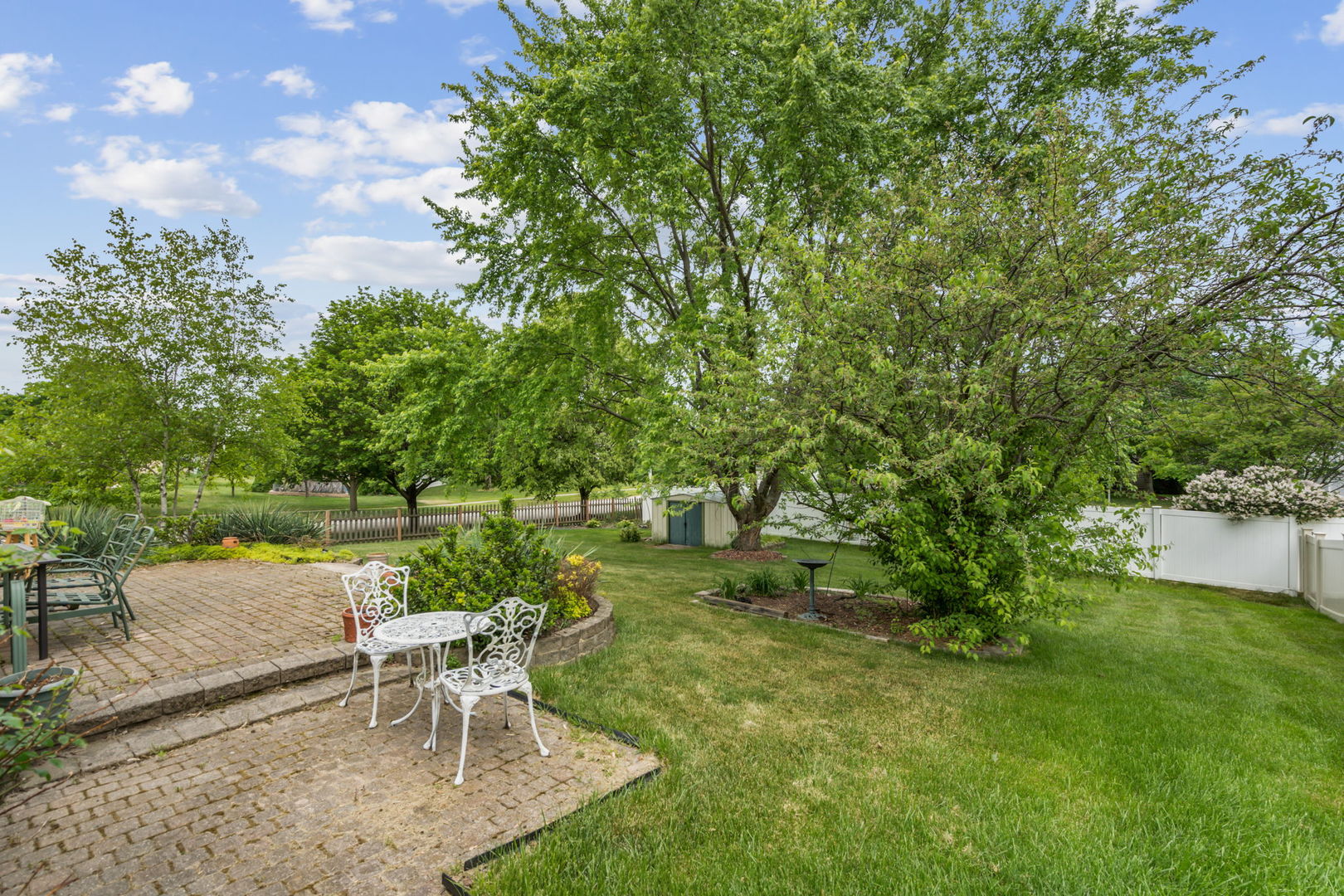 238 Ironbark Way Bolingbrook, IL 60440 - Photo 20 of 21 a view of a lake with a patio