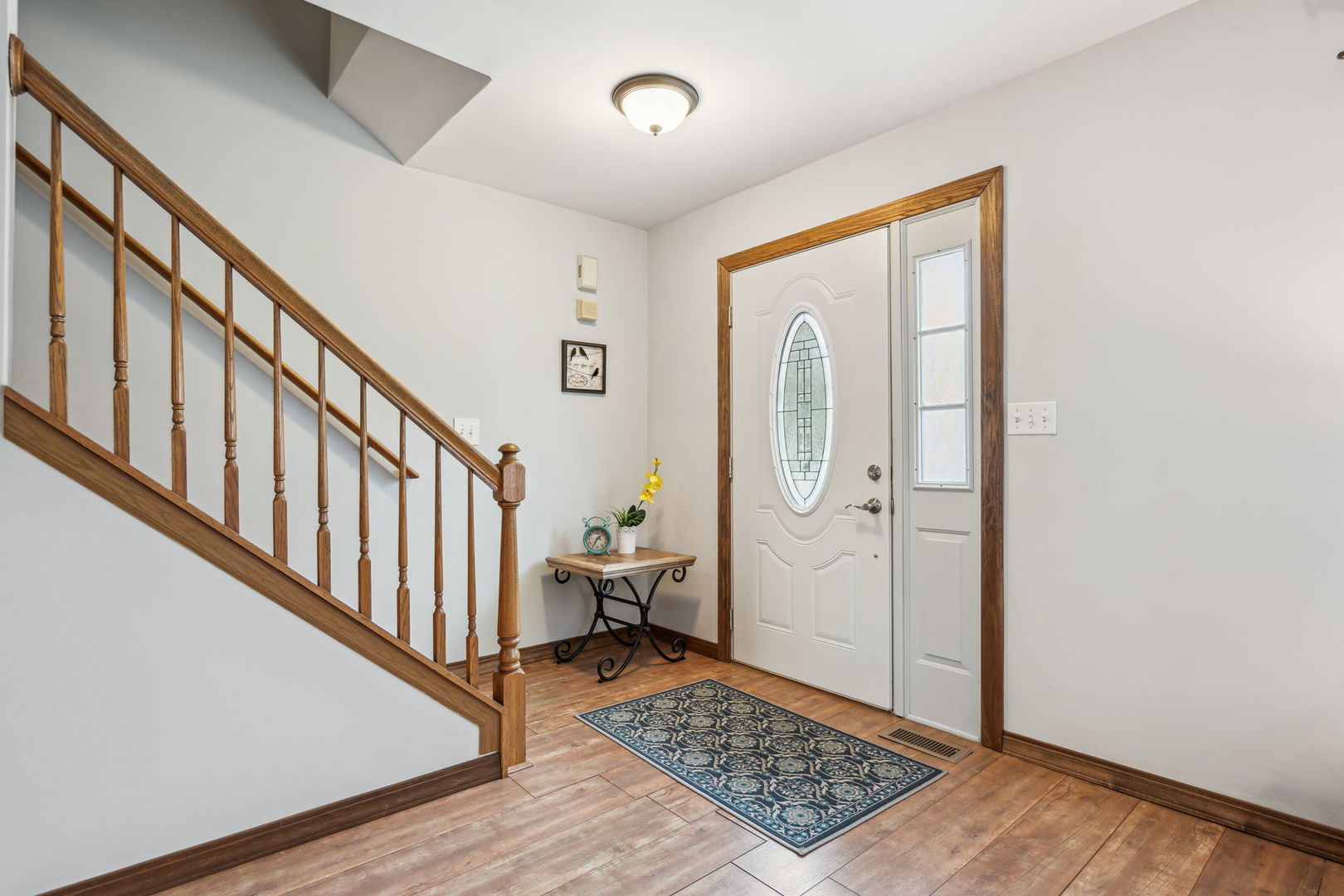 238 Ironbark Way Bolingbrook, IL 60440 - Photo 2 of 21 a view of a hallway with wooden floor and entryway