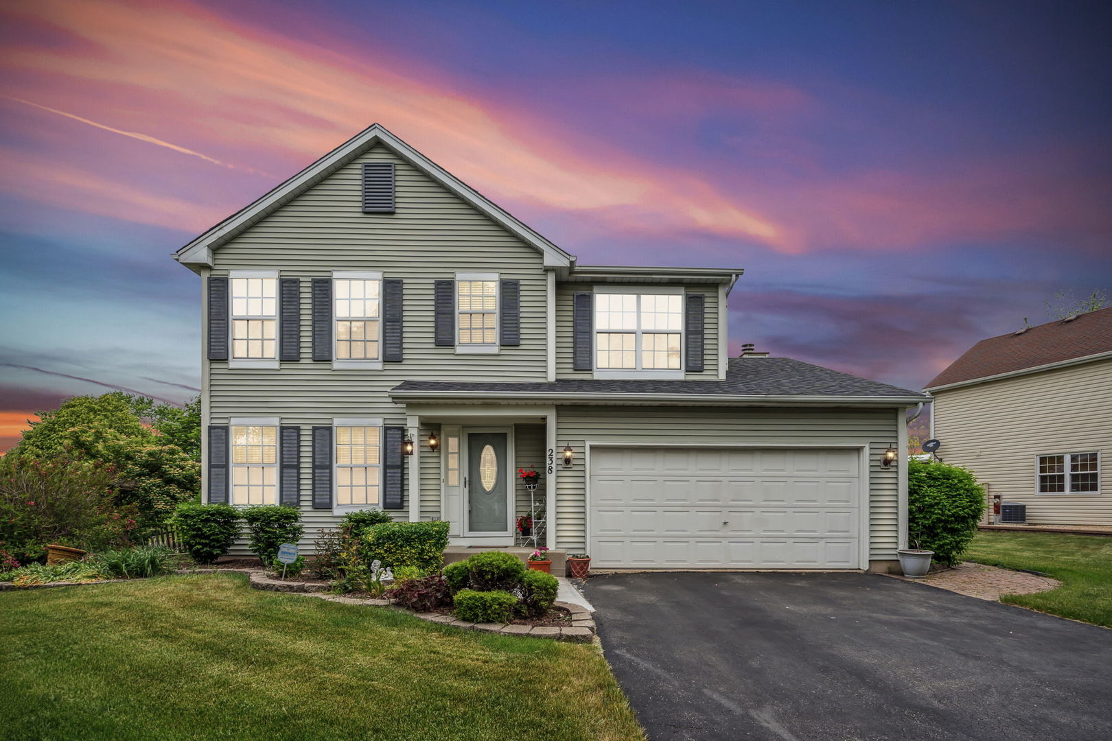 238 Ironbark Way Bolingbrook, IL 60440 - Photo 21 of 21 a front view of a house with a yard and garage