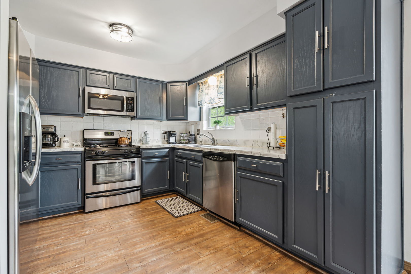 238 Ironbark Way Bolingbrook, IL 60440 - Photo 8 of 21 a kitchen with granite countertop a refrigerator stove top oven and sink