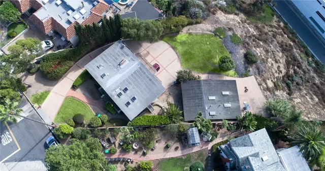an aerial view of a house with a garden