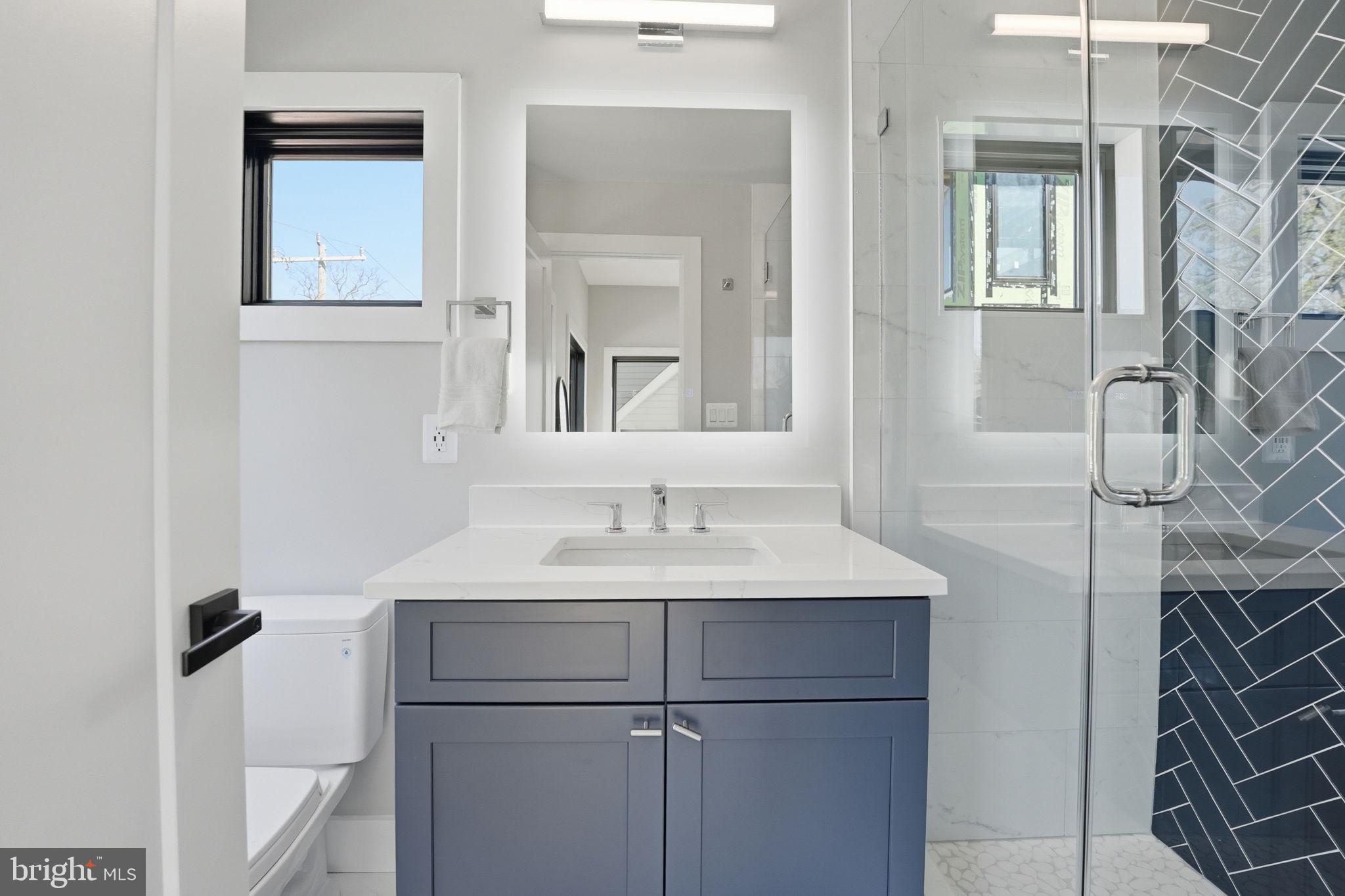2211 Military Road Arlington, VA 22207 - Photo 33 of 107 Sleek modern bathroom with stylish finishes.