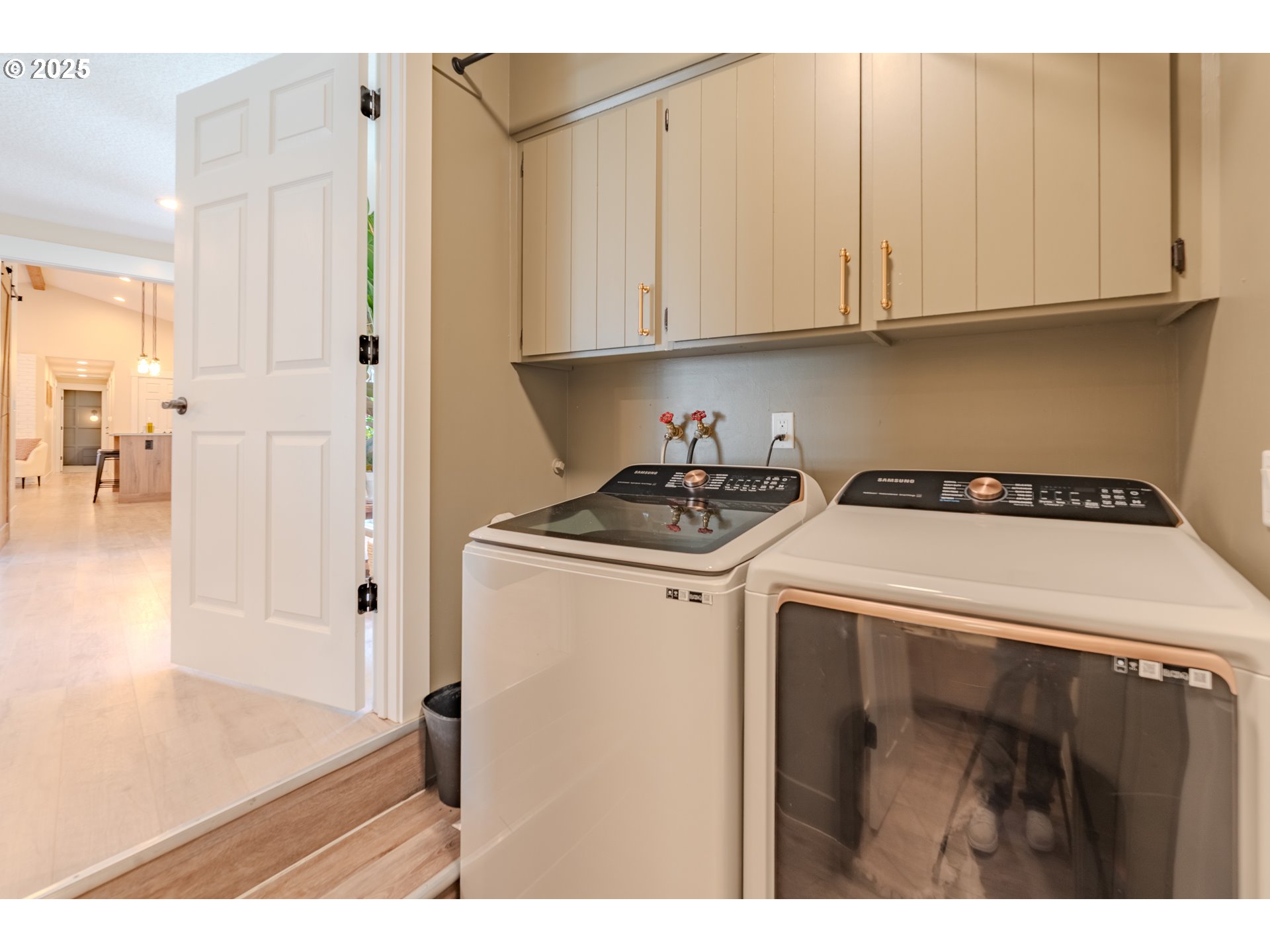 20908 Northeast 67th Avenue Battle Ground, WA 98604 - Photo 16 of 47 a utility room with stainless steel appliances white cabinets and a refrigerator