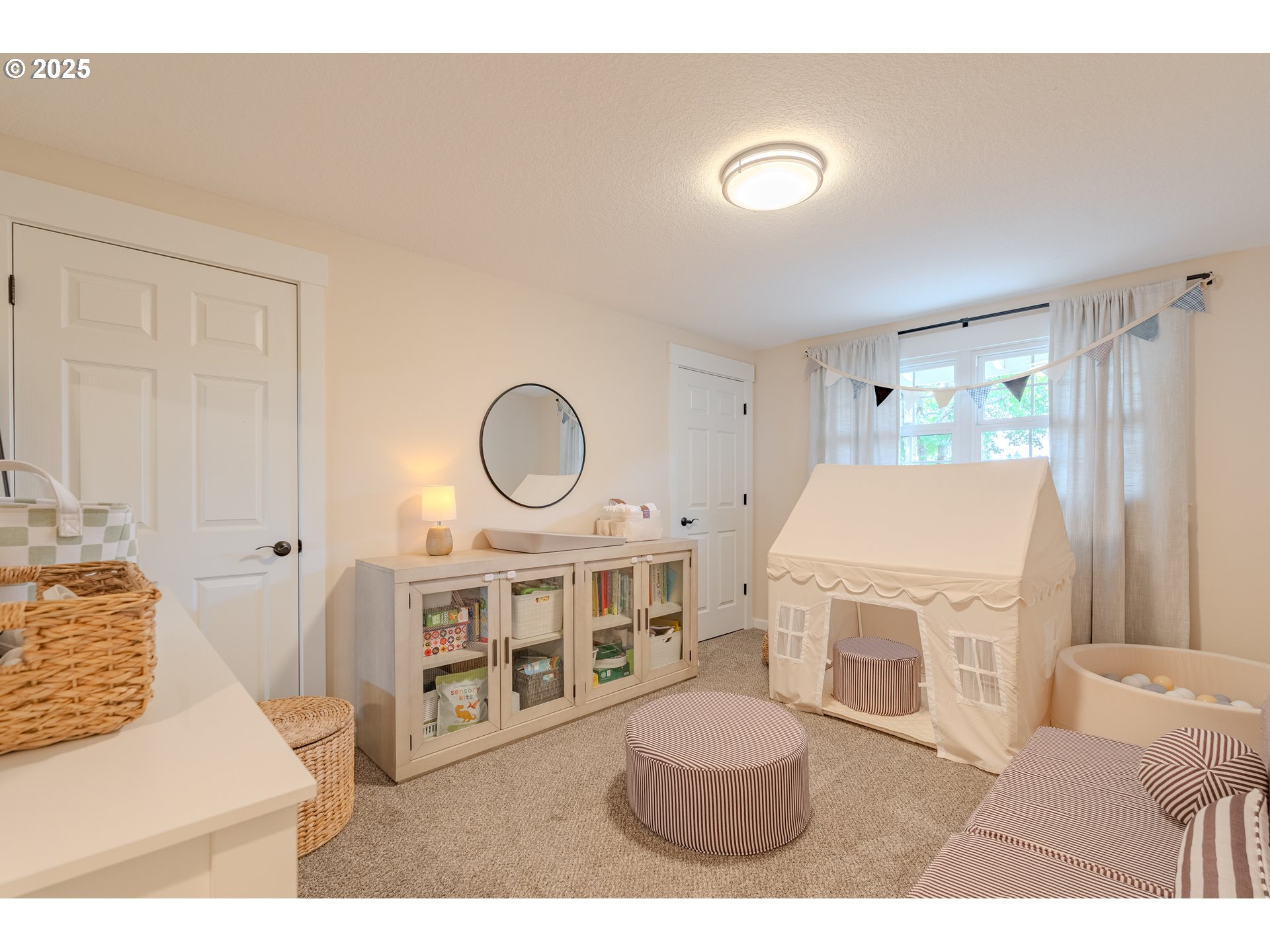 20908 Northeast 67th Avenue Battle Ground, WA 98604 - Photo 19 of 47 a living room with furniture a flat screen tv and a large window