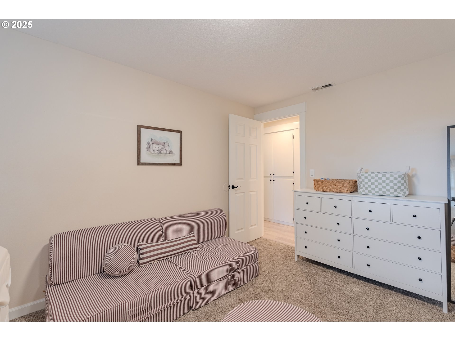 20908 Northeast 67th Avenue Battle Ground, WA 98604 - Photo 20 of 47 a bedroom with a bed and a night stand