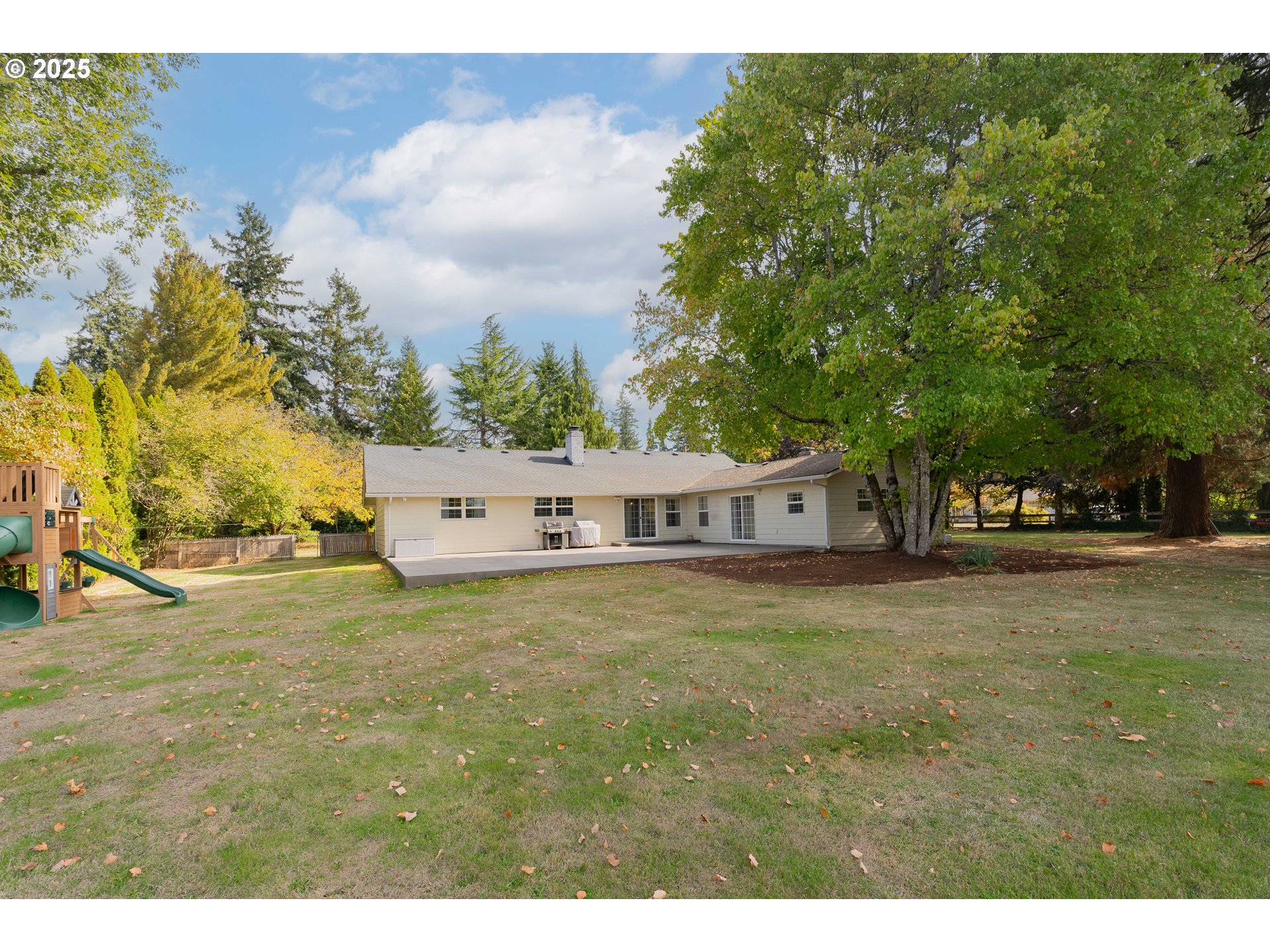20908 Northeast 67th Avenue Battle Ground, WA 98604 - Photo 40 of 47 a view of a yard in front of a house with large tree