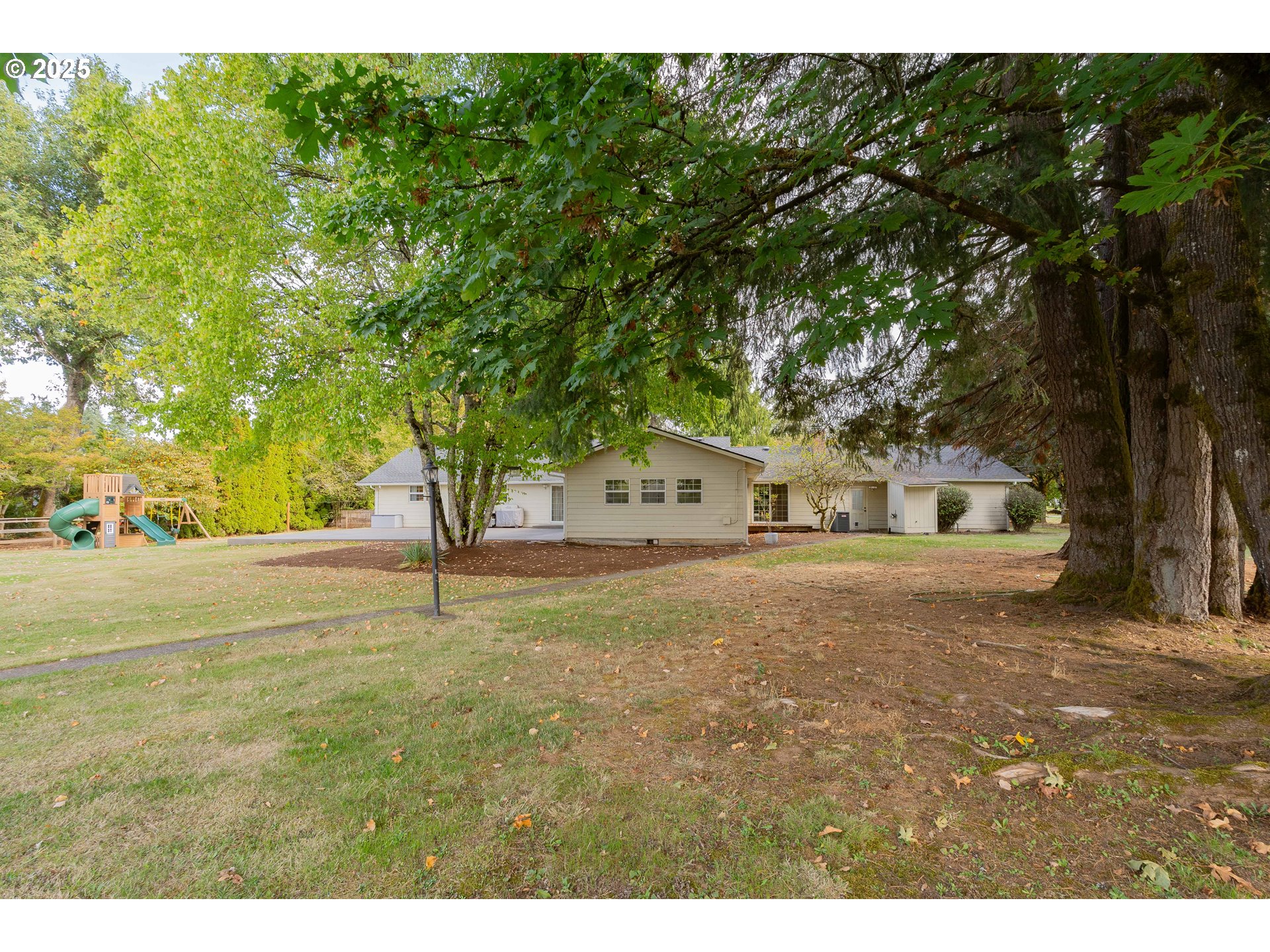 20908 Northeast 67th Avenue Battle Ground, WA 98604 - Photo 42 of 47 a front view of a house with a yard and trees