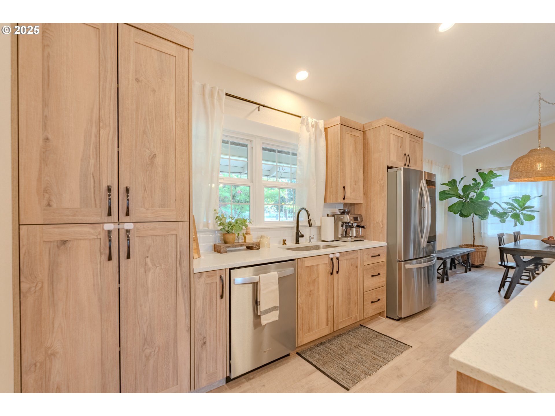 20908 Northeast 67th Avenue Battle Ground, WA 98604 - Photo 10 of 47 a large white kitchen with lots of counter space and appliances