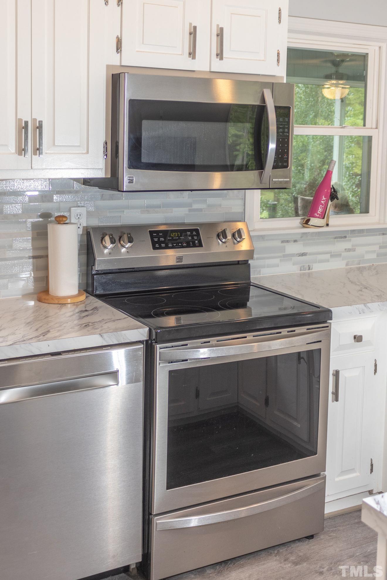 70 Waters Edge Loop Henderson, NC 27537 - Photo 16 of 49 a stove top oven sitting inside of a kitchen