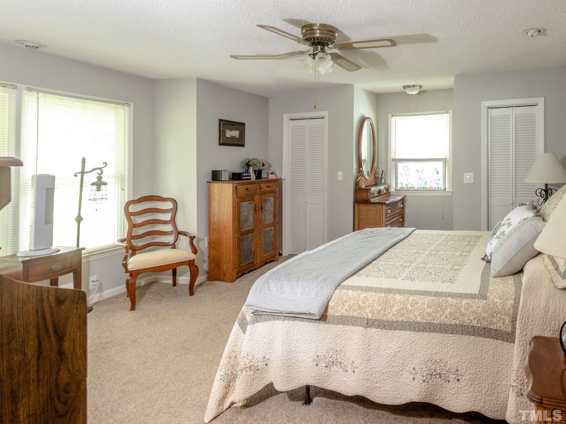 70 Waters Edge Loop Henderson, NC 27537 - Photo 22 of 49 a bedroom with a bed and furniture
