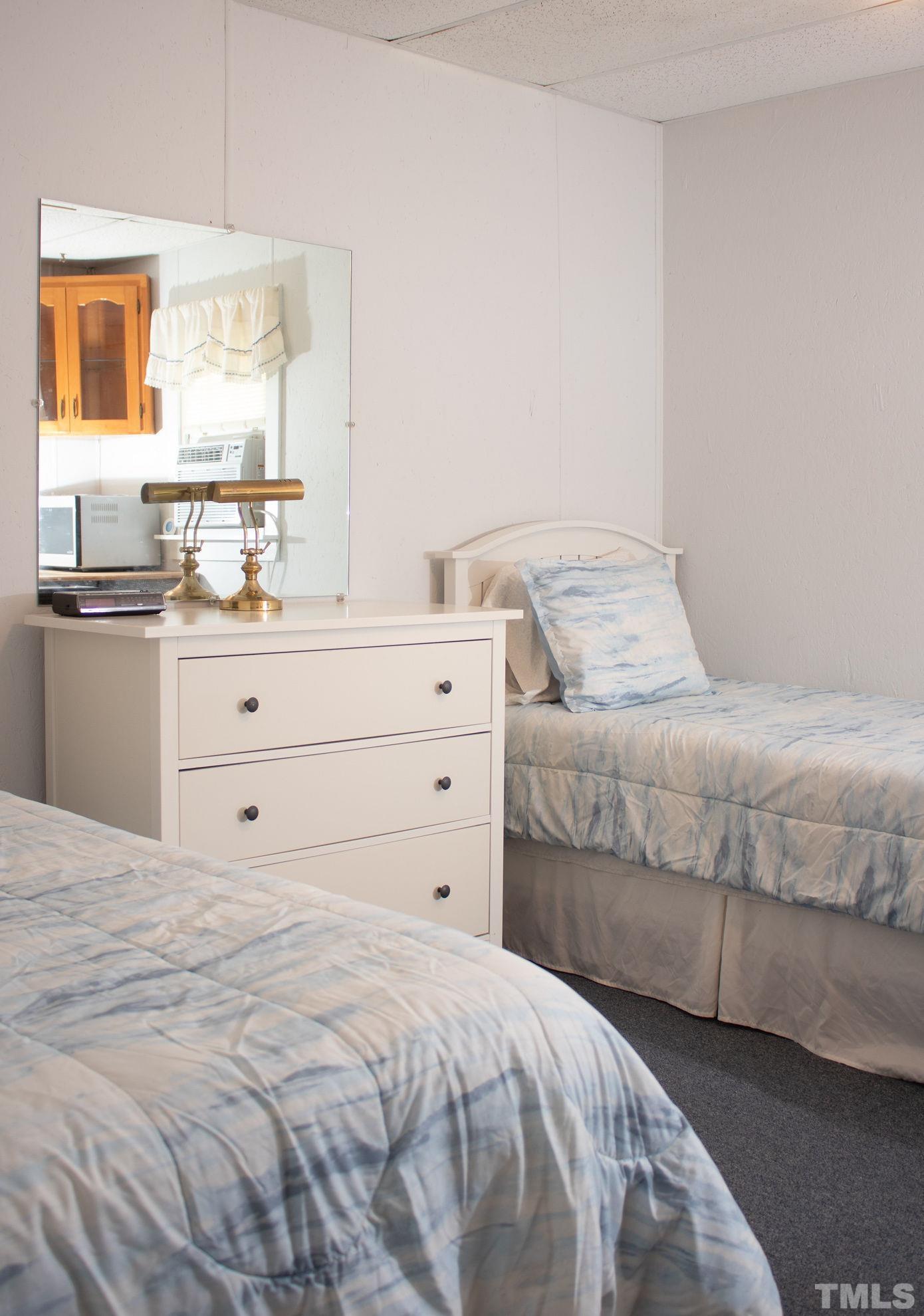 70 Waters Edge Loop Henderson, NC 27537 - Photo 32 of 49 a bedroom with a bed and a window