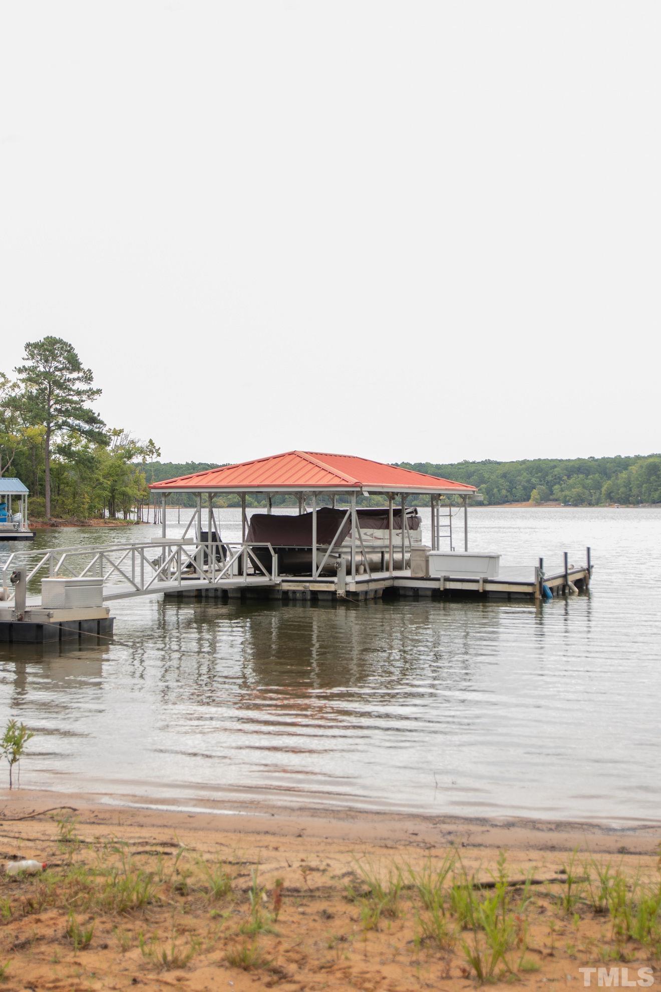 70 Waters Edge Loop Henderson, NC 27537 - Photo 4 of 49 a view of a lake with houses