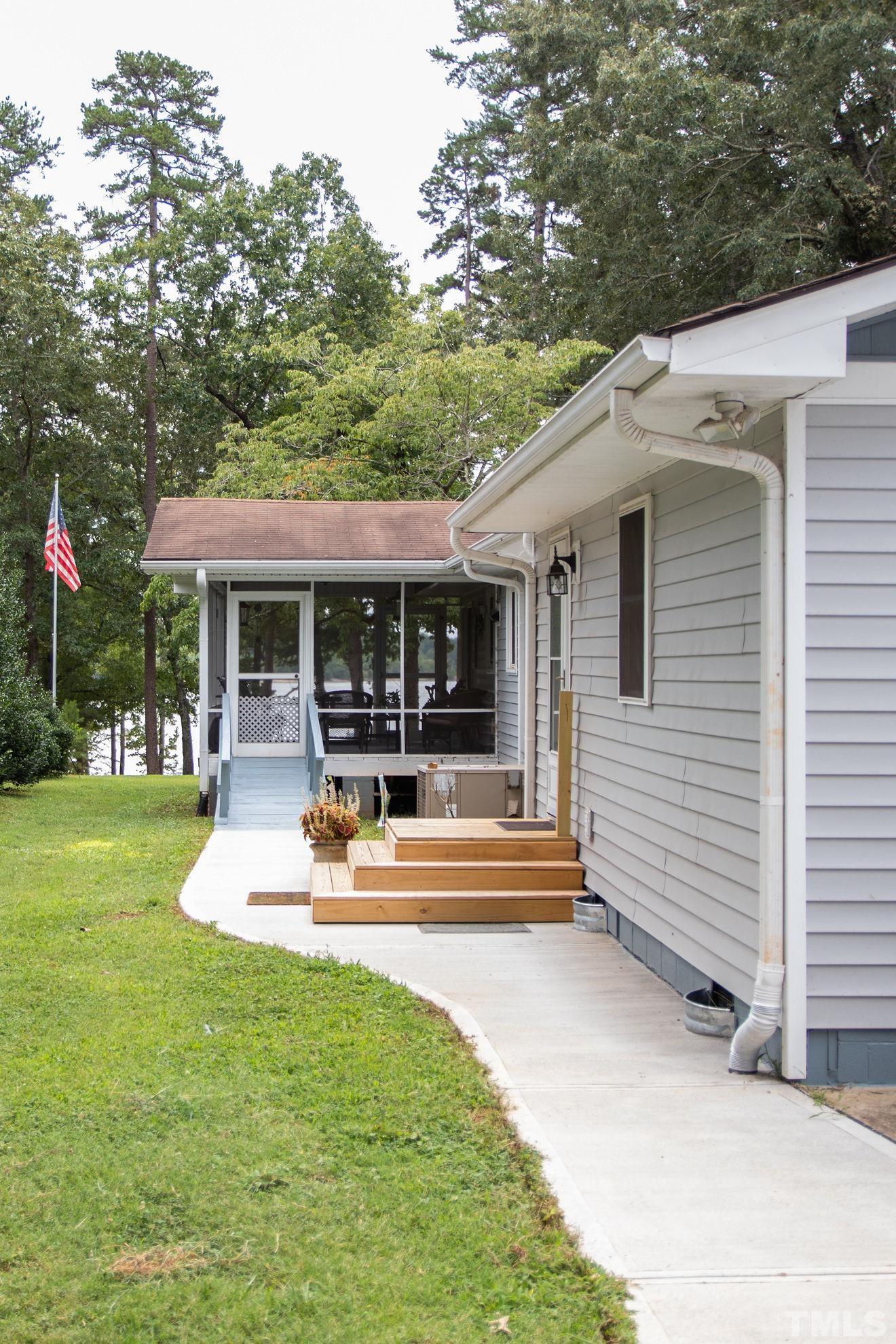 70 Waters Edge Loop Henderson, NC 27537 - Photo 8 of 49 a view of a house with sitting area and garden