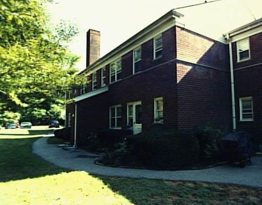 246 Glenbrook Road, Unit 36D Stamford, CT 06906 - Photo 1 of 1 a backyard of a house with lots of green space