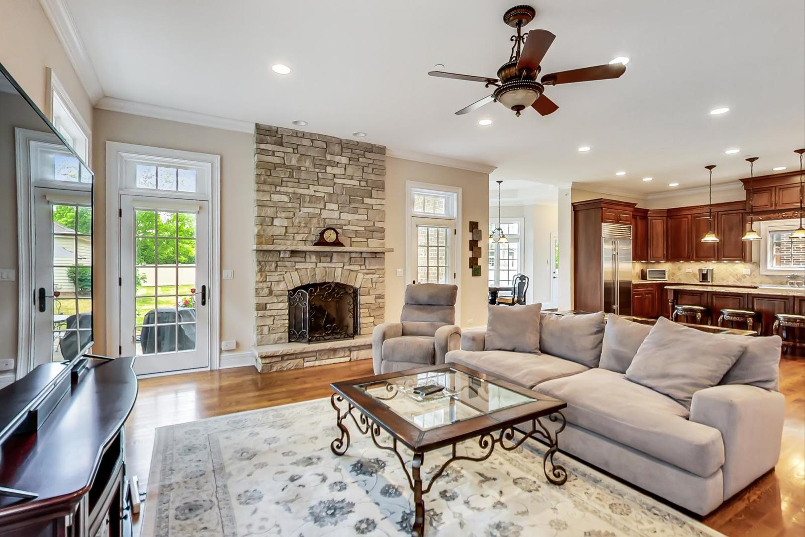 827 South Chester Avenue Park Ridge, IL 60068 - Photo 11 of 38 a living room with furniture ceiling fan and a fireplace